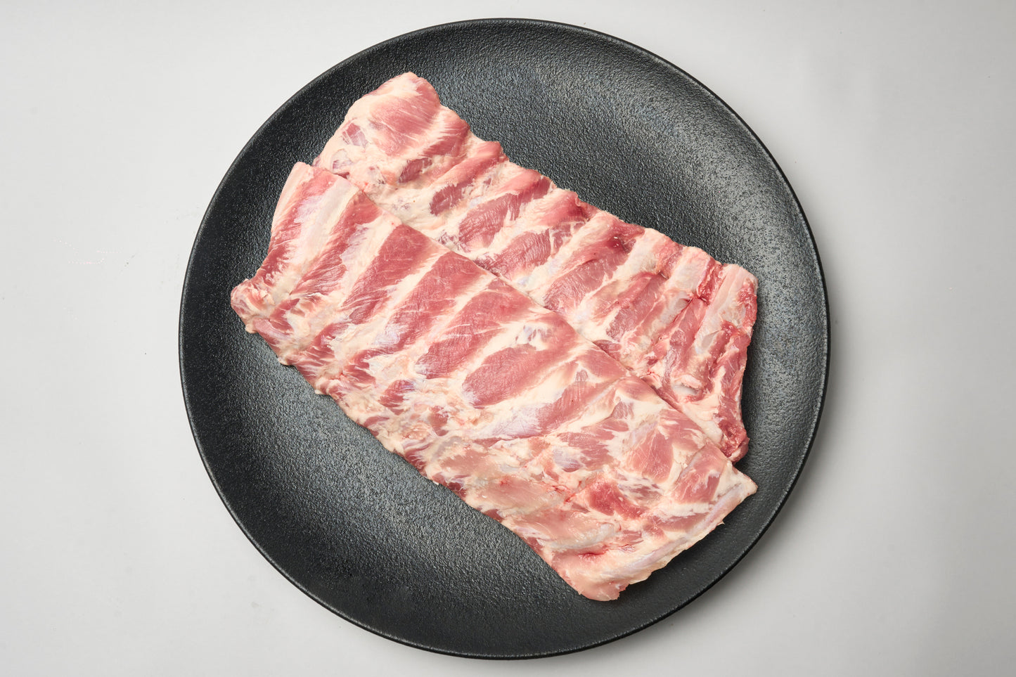 Pasture-raised racks of pork ribs 1Kg